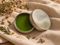 Balm open tin on linen